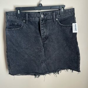 Denim mini skirt. Distressed hem. New with tags. Size 10.